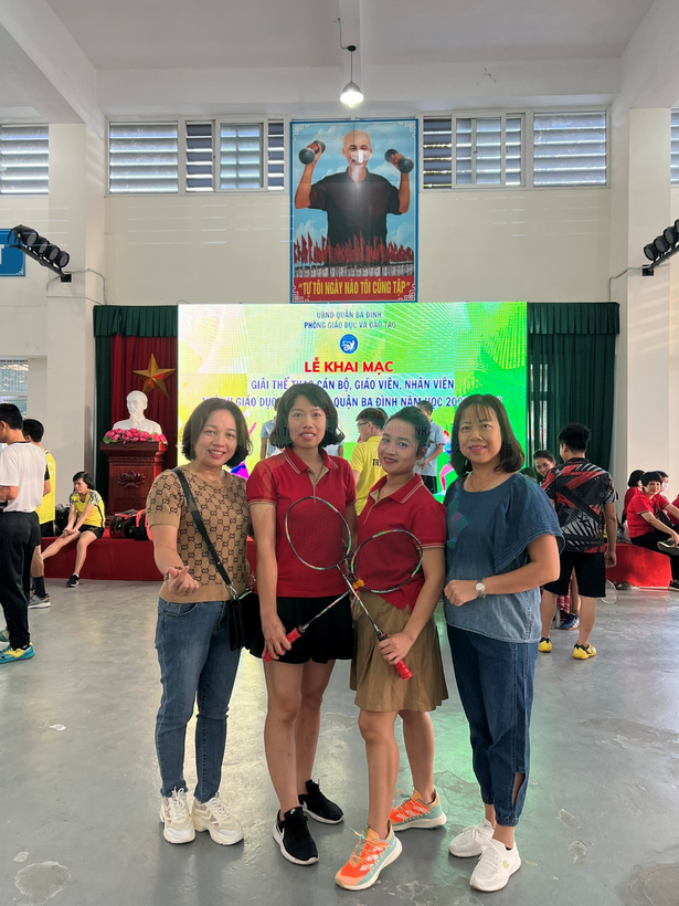 A group of people posing for a photo
Description automatically generated