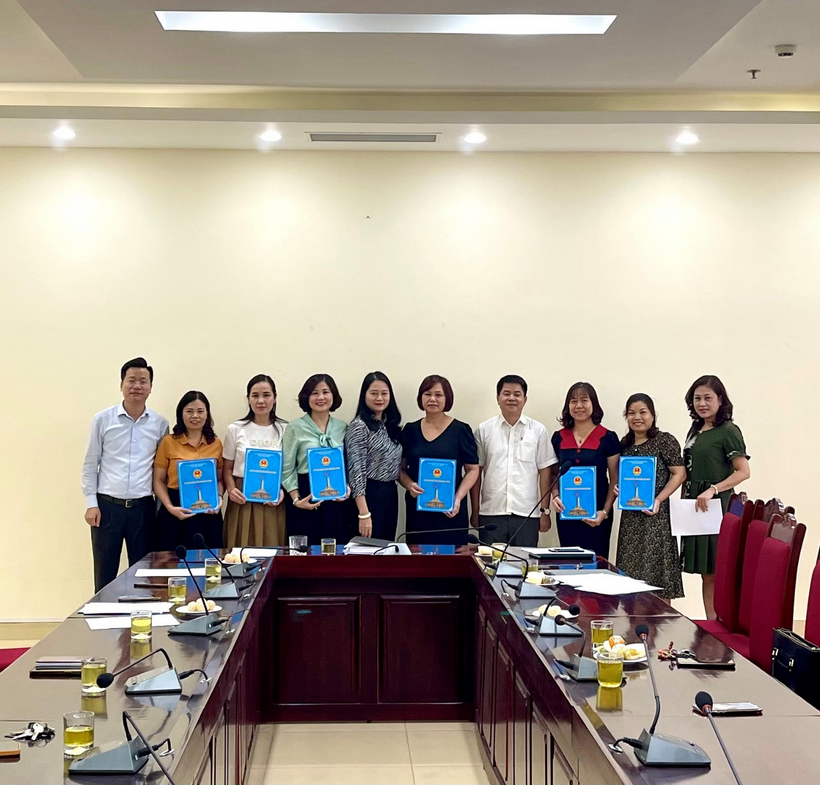 A group of people posing for a photo
Description automatically generated