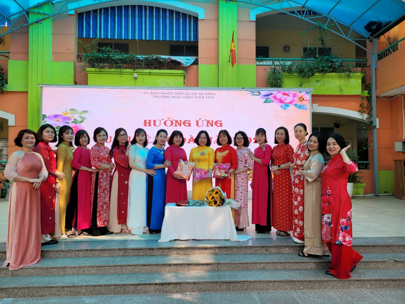 A group of women in red dresses standing on a stage
Description automatically generated with low confidence