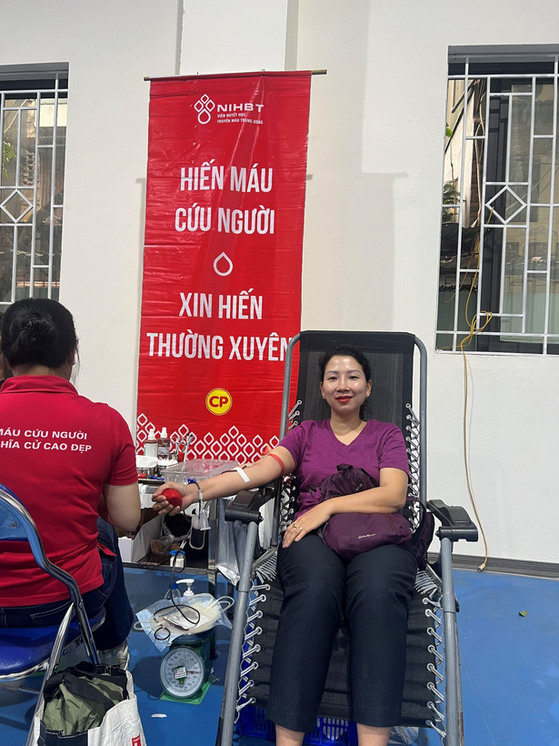 A picture containing text, person, outdoor, posing
Description automatically generated