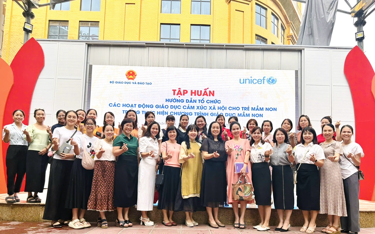 A group of women posing for a photo
AI-generated content may be incorrect.